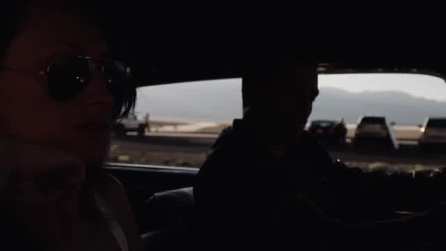 Chances film still: passengers inside a car with mountains beyond the windows